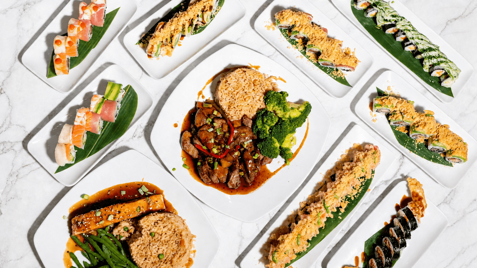 A table filled with World Fusion sushi rolls and globally inspired dishes